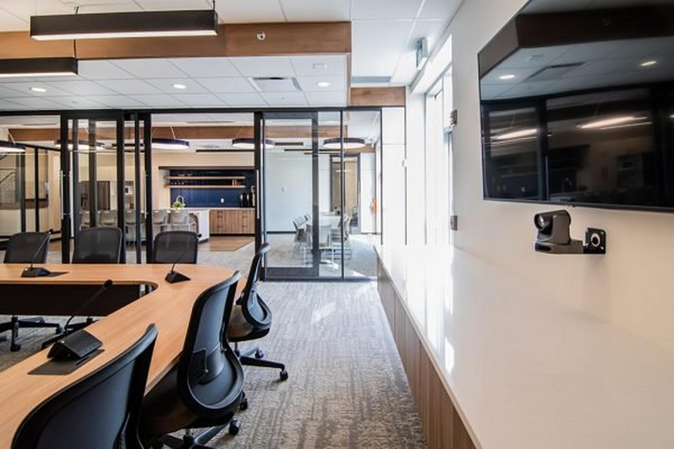 a conference room with a large table and chairs